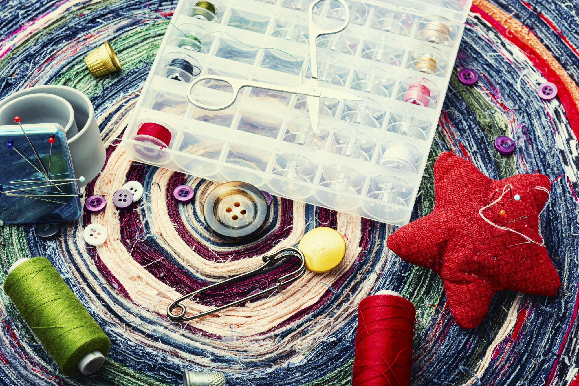 Studio workspace with hoops, threads and sample patches