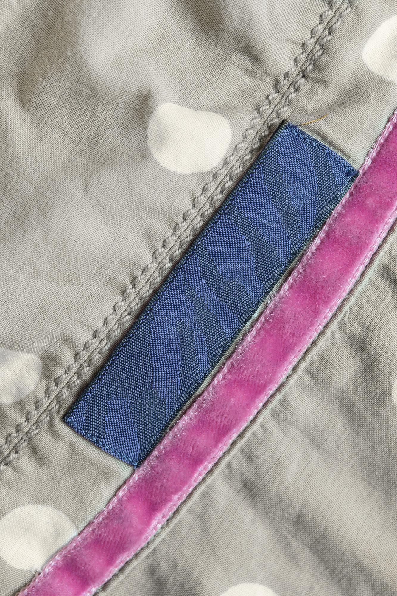 Finished embroidered patch on garment